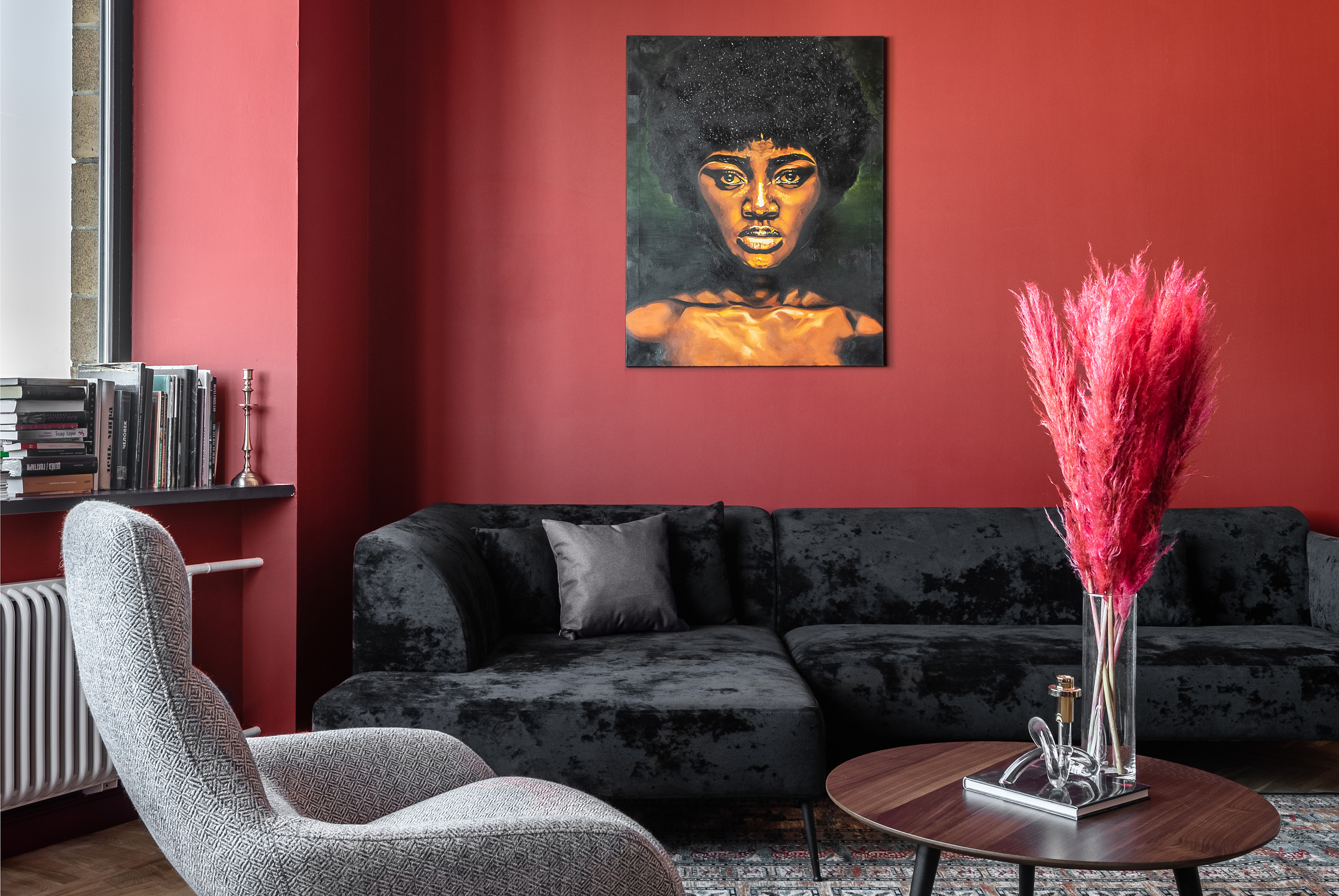 Red living room with black sofa